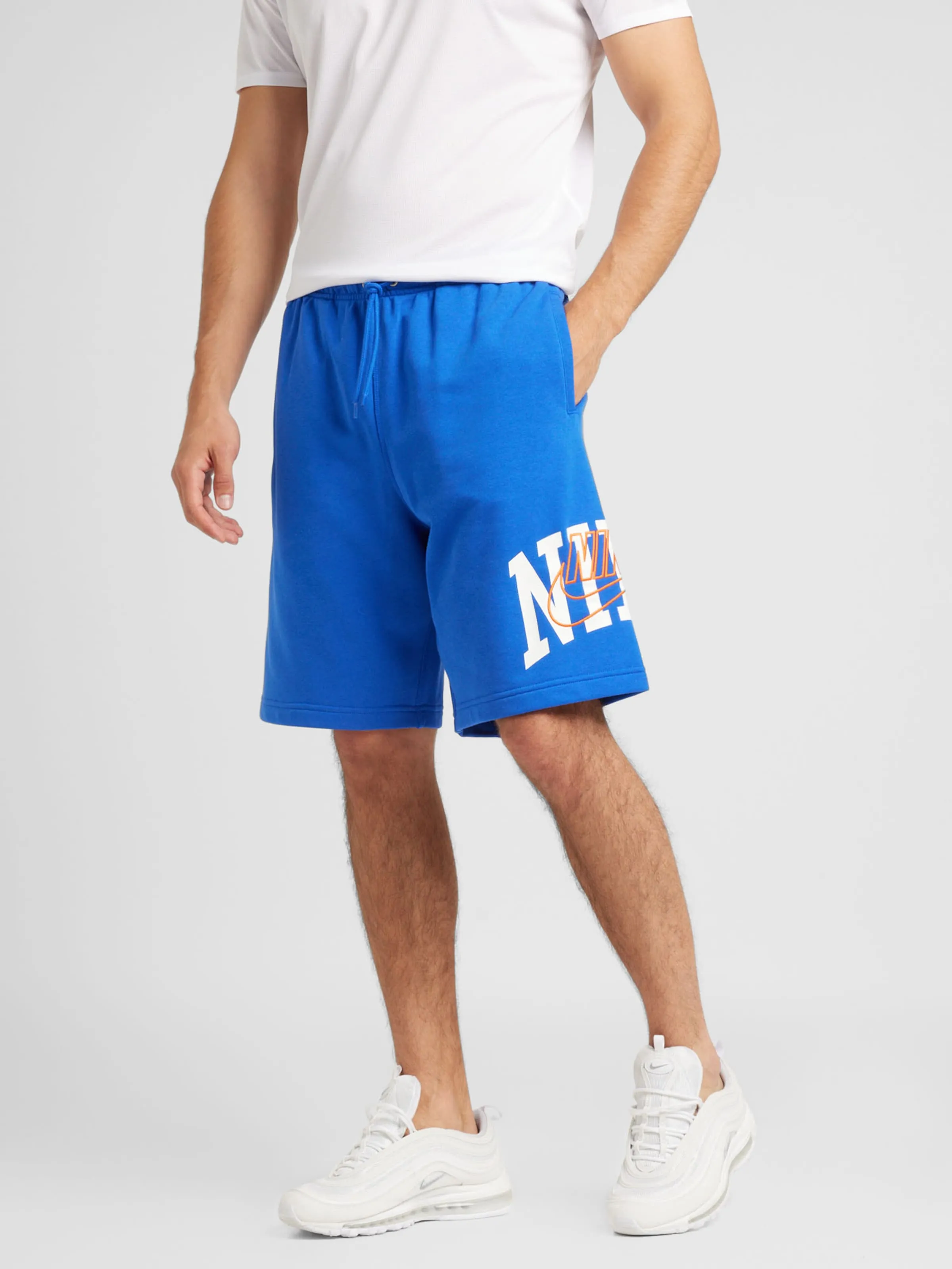 Loosefit Pantalón 'CLUB' Nike Sportswear en Azul Real