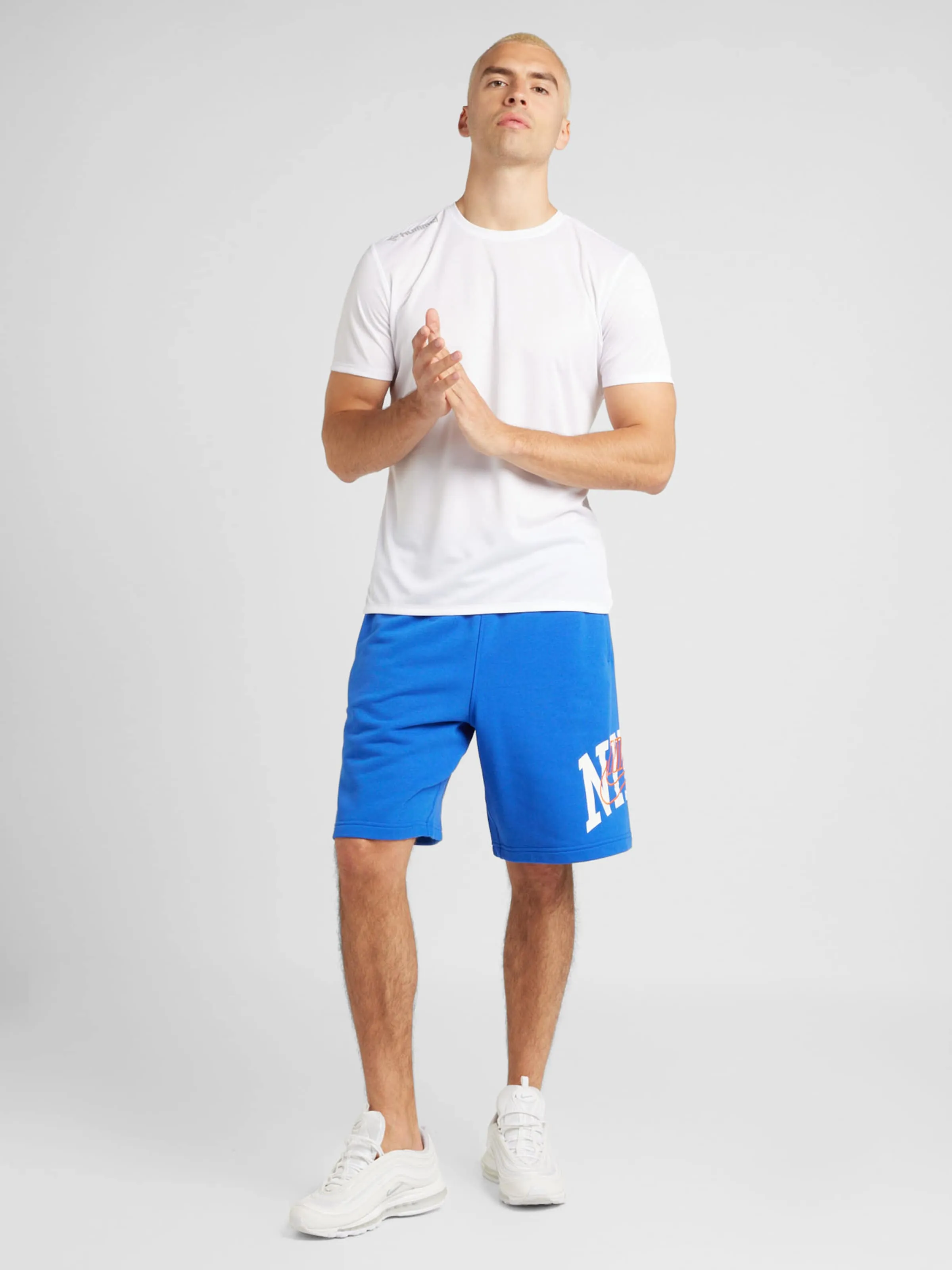 Loosefit Pantalón 'CLUB' Nike Sportswear en Azul Real